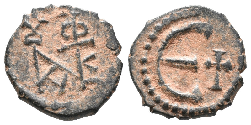 Justin II (565-578). Æ 5 Nummi (13mm, 1.20g). Theoupolis (Antioch). Monogram. R/...