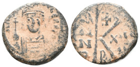 Maurice Tiberius (582-602). Æ 20 Nummi (26mm, 4.43g). Constantinople. Diademed, helmeted and cuirassed facing bust, holding globus cruciger. R/ Large ...
