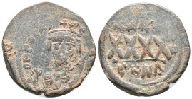 Phocas (602-610). Æ 40 Nummi (28mm, 11.54g). Constantinople, year 4(?). Crowned bust facing, wearing consular robes, holding mappa and cross. R/ Large...