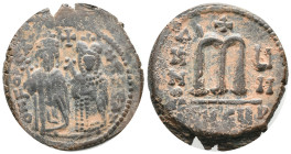 Phocas (602-610). Æ 40 Nummi (26mm, 10.46g). Theoupolis (Antioch), year 4. Phocas and Leontia standing facing, the Emperor holding globus cruciger, th...