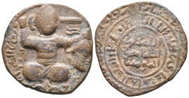 Islamic, Artuqids, Æ (31mm, 14.60g). Turk, in military outfit and cross legged, seated facing, holding severed head and raised sword. R/ Legend. Near ...