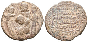 Islamic, Artuqids, Æ (28mm, 11.77g). Three standing figures around central female figure seated left in attitude of mourning. R/ Legend. Near VF