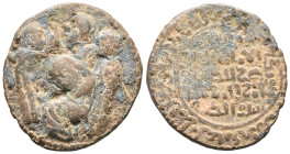 Islamic, Artuqids, Æ (30mm, 12.48g). Three standing figures around central female figure seated left in attitude of mourning. R/ Legend. Good Fine