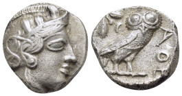 ATTICA. Athens.(Circa 454-404 BC).Tetradrachm.

Obv : Helmeted head of Athena right.

Rev : AΘE.
Owl standing right, head facing; olive sprig and cres...