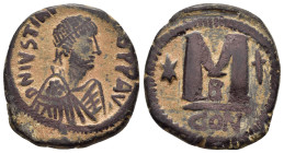 JUSTIN I.( 518-527).Constantinople.Follis.

Obv : DN IVSTINVS PP AVG; pearl diademed, draped, cuirassed bust right.

Rev : Large M, star left, cross a...