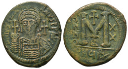 JUSTINIAN I (527-565).Antioch.Follis.

Obv : D N IVSTINIANVS P P A.
Helmeted and cuirassed bust facing, holding globus cruciger and shield; cross to r...