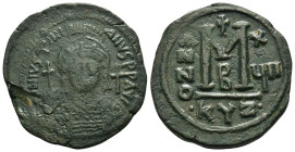 JUSTINIAN I.(527-565).Cyzicus.Follis.

Obv : D N IVSTINIANVS P P AVG.
Helmeted and cuirassed bust facing, holding globus cruciger and shield decorated...