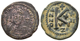 JUSTINIAN I.(527-565).Cyzicus.Half Follis.

Obv : D N IVSTINIANVS P P AVC.
Helmeted and cuirassed bust of Justinian I facing, holding globus cruciger ...