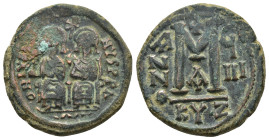 JUSTIN II and SOPHIA.(565-578).Cyzicus.Follis.

Obv : D N IVSTI NVS PP AV.
Justin and his wife Sophia, both nimbate, seated facing on throne: the Empe...