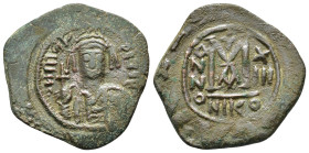 MAURICE TIBERIUS.(582-602). Nicomedia.Follis.

Obv : D N MAVR BIRЄ P P.
Helmeted and cuirassed bust facing, holding globus cruciger and shield decorat...