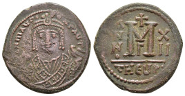 MAURICE TIBERIUS.(582-602).Antioch.Follis.

Obv : D N MAURI C N P AVT.
Crowned facing bust, wearing consular robes, holding mappa and eagle-tipped sce...