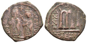 PHOCAS with LEONTIA (602-610). Theoupolis (Antioch).Follis.

Obv : D N FOCA NЄ PЄ AV.
Phocas, holding globus cruciger, and Leontia, holding cruciform ...