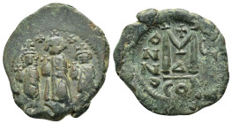 HERACLIUS with MARTINA and HERACLIUS CONSTANTINE.(610-641). Follis.

Obv : Martina on left, Heraclius, bearded, in centre, and Heraclius Constantine, ...