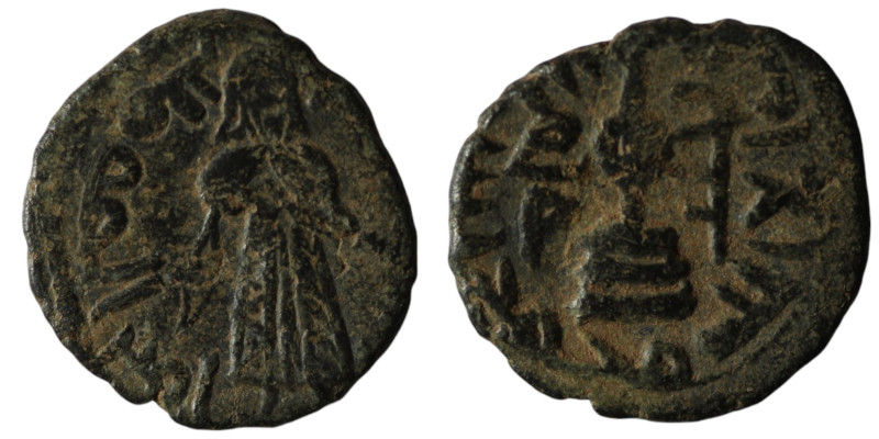 Byzantine-Islamic. Umayyad Fals `Abd al-Malik ibn Marwan. (685-705 AD) CU. 19mm,...