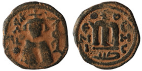 Arab-Byzantine. Umayyad Caliphate. 'Abd al-Malik ibn Marwan. (685-705 AD). Follis. Emesa. Obv: emperor facing holding golbus cruciger. Rev: M. artific...