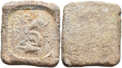 Lead Tessera
(50.96g 35.3mm diameter)
Obv: Sphinx seated on amphora.
Rev: Blank