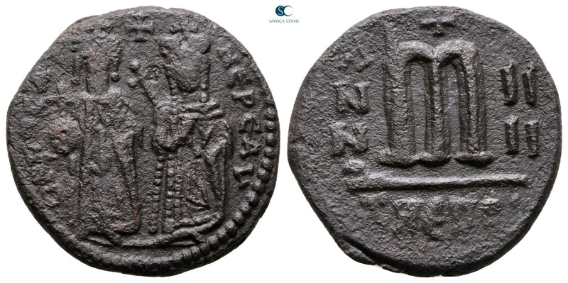 Phocas, with Leontia AD 602-610. Theoupolis (Antioch)
Follis or 40 Nummi Æ

2...