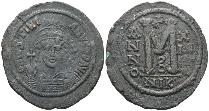 Justinian Æ Nummus. Constantinopolis, AD 527-565. D N IVSTINIANVS P P AVG, helme...