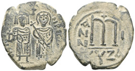 ByzantinePhocas, with Leontia, 602-610. Follis (Bronze), Cyzicus. Phocas, on the left, standing facing, holding globus cruciger in his right hand; Leo...