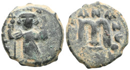 Byzantine
Constans II, AE, Follis. (Bronze.) Constantinople, 641-668 AD. 
Obv: [EN] TV[TO NIKA], Constans beardless, crowned and wearing chlamys, stan...