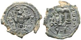 Byzantine
Arab-Byzantine (c. 660s-680s) AE Fals (Bronze, 22mm, 4.89g)
Obv: Emperor standing facing, holding long cross and globus cruciger.
Rev: Cursi...