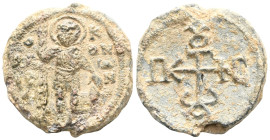 Byzantine Lead Seal: Petros Patrikios (11th century)
Obverse: Soldier with saint standing and halo. In military uniform. He is leaning on a spear in ...