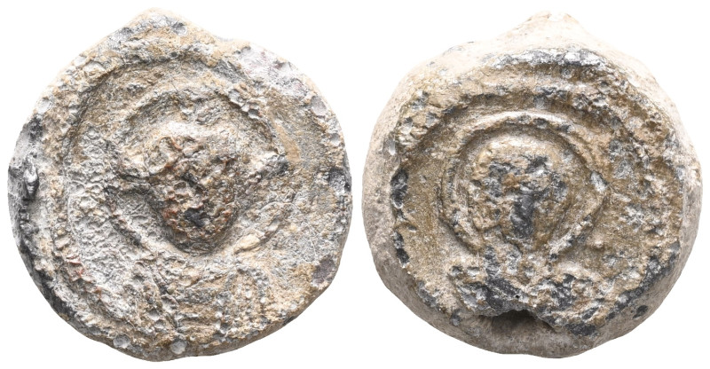 Byzantine Lead Seal: (6th century)
Obverse: Corroded saint bust with halo. Wrea...