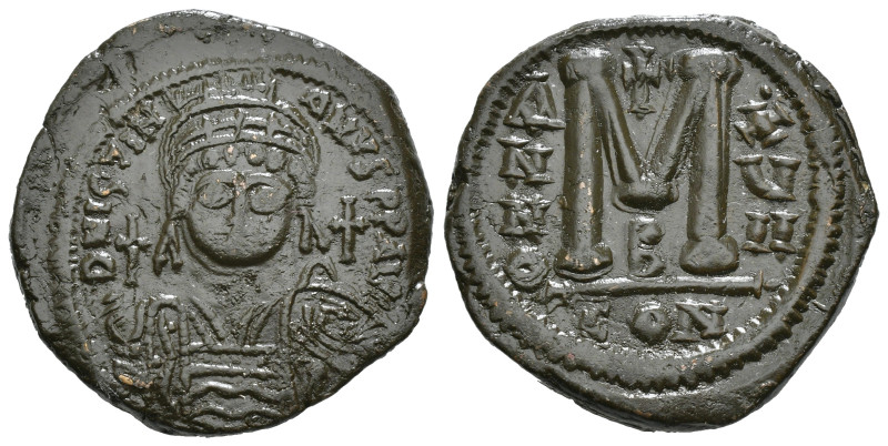 JUSTINIAN I (527-565). Follis.
Obv: D N IVSTINIANVS P P AVG.
Helmeted and cuir...