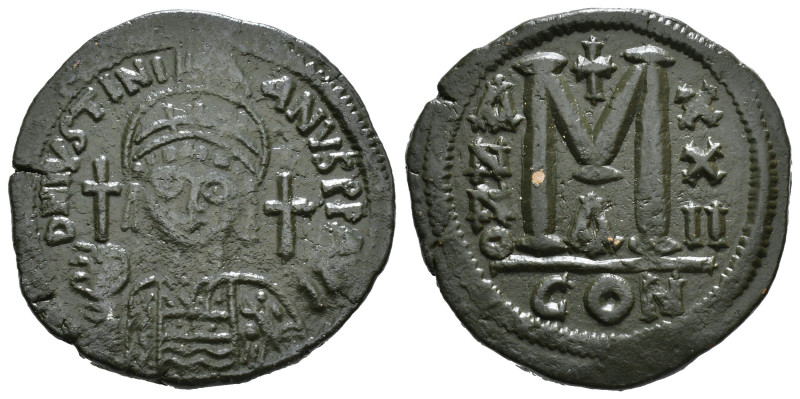 JUSTINIAN I (527-565). Follis.
Obv: D N IVSTINIANVS P P AVG.
Helmeted and cuir...