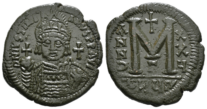 JUSTINIAN I (527-565). Follis.
Obv: D N IVSTINIANVS P P AVG.
Helmeted and cuir...