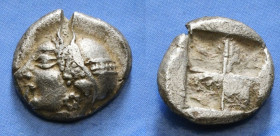 IONIA. Phokaia. Diobol (Circa 521-478 BC).
Obv: Archaic female head left, wearing earring and helmet or close fitting cap.
Rev: Quadripartite incuse...