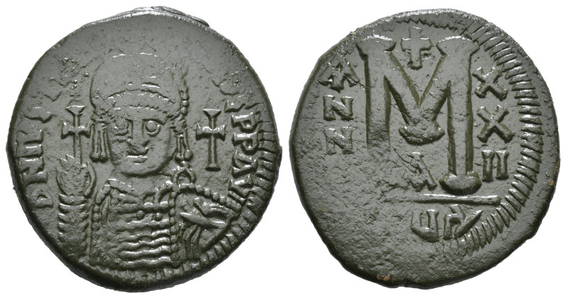 JUSTINIAN I (527-565). Follis.
Obv: D N IVSTINIANVS P P AVG.
Helmeted and cuir...