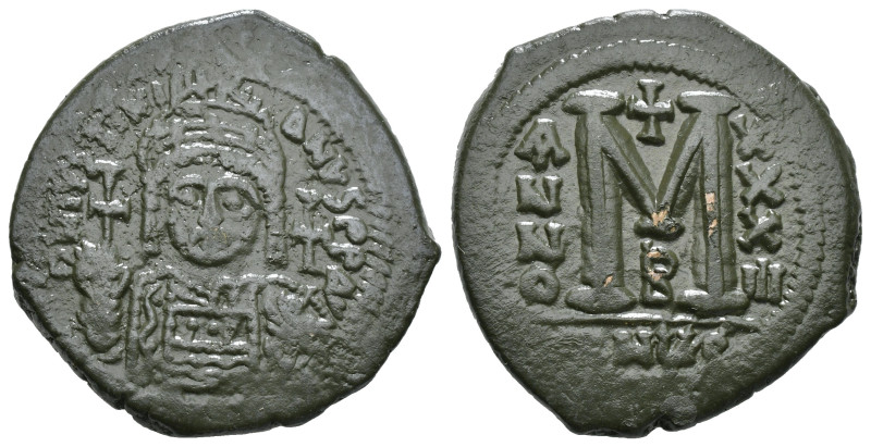 JUSTINIAN I (527-565). Follis.
Obv: D N IVSTINIANVS P P AVG.
Helmeted and cuir...