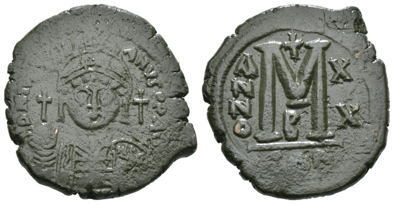 JUSTINIAN I (527-565). Follis.
Obv: D N IVSTINIANVS P P AVG.
Helmeted and cuir...