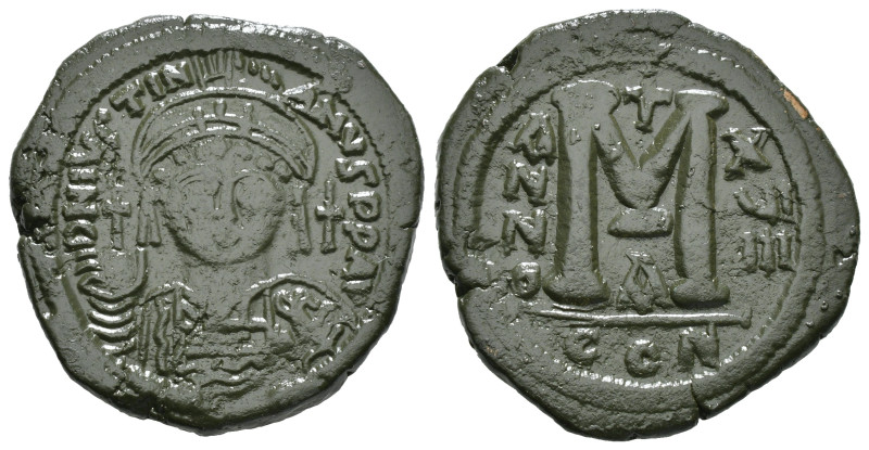 JUSTINIAN I (527-565). Follis.
Obv: D N IVSTINIANVS P P AVG.
Helmeted and cuir...