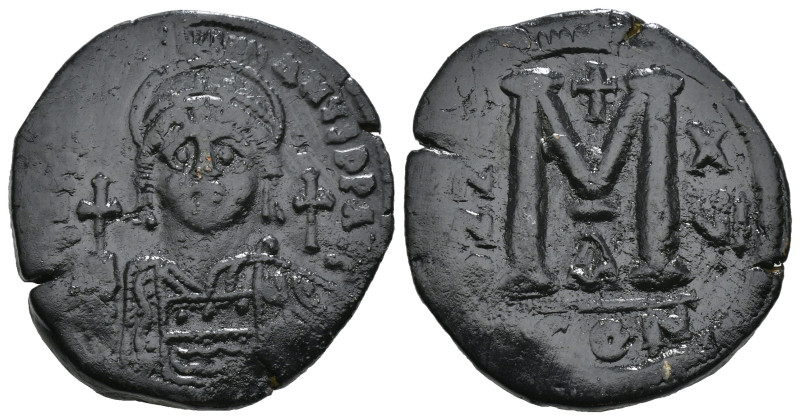 JUSTINIAN I (527-565). Follis.
Obv: D N IVSTINIANVS P P AVG.
Helmeted and cuir...