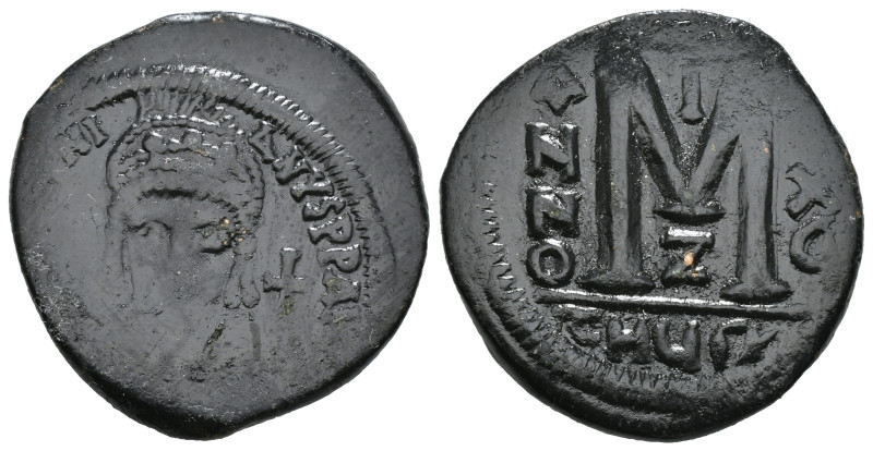 JUSTINIAN I (527-565). Follis.
Obv: D N IVSTINIANVS P P AVG.
Helmeted and cuir...