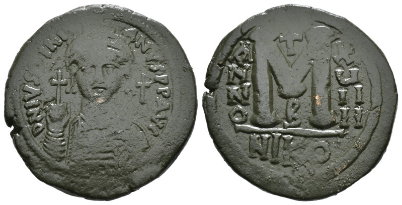 JUSTINIAN I (527-565). Follis.
Obv: D N IVSTINIANVS P P AVG.
Helmeted and cuir...