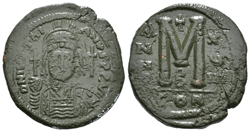 JUSTINIAN I (527-565). Follis.
Obv: D N IVSTINIANVS P P AVG.
Helmeted and cuir...