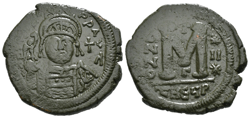 JUSTINIAN I (527-565). Follis.
Obv: D N IVSTINIANVS P P AVG.
Helmeted and cuir...