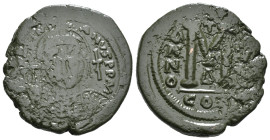 JUSTINIAN I (527-565). Follis.
Obv: D N IVSTINIANVS P P AVG.
Helmeted and cuirassed bust facing, holding globus cruciger and shield decorated with h...