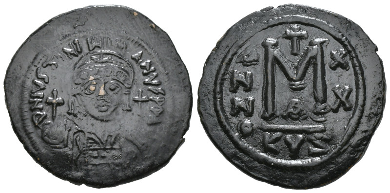 JUSTINIAN I (527-565). Follis.
Obv: D N IVSTINIANVS P P AVG.
Helmeted and cuir...