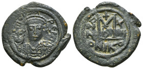 Heraclius AD 610-641. Nikomedia Follis or 40 Nummi Æ. Helmeted and cuirassed facing bust, holding cross / Large M; cross above, date across fields; A/...