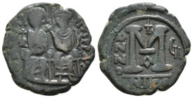 JUSTIN II (565-578). Follis. Nicomedia. Dated RY 9 (573/4).
Obv: D N IVSTINVS P P AVC.
Justin, holding globus cruciger, and Sophia, holding crucifor...
