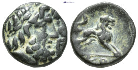 Pisidia, Komana. ca. 1st century B.C. AE (2 Gr. 12mm.)
 Laureate head of Zeus right 
Rev. Lion springing right. KO.