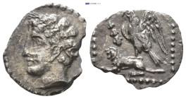 CILICIA. Uncertain. (4th century BC). AR Obol. (9.5mm, 0.53 g) Obv: Male head left, wearing grain wreath. Rev: Eagle standing left on back of lion sea...