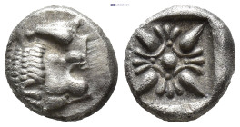 IONIA, Miletos. ca. 500 BC. AR Diobol (8.5mm, 0.82 g) Forepart of lion to left, his head turned back to right. Rev.Starlike floral ornament in shallow...