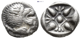 IONIA, Miletos. ca. 500 BC. AR Diobol (8mm, 1.0 g) Forepart of lion to left, his head turned back to right. Rev.Starlike floral ornament in shallow in...