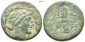 IONIA. Smyrna. Ae (20mm, 5.78 g) (Circa 75-50 BC). Obv: Laureate head of Apollo right, all within wreath. Rev: ΣΜΥΡΝΑΙΩΝ. Homer, holding scroll and re...