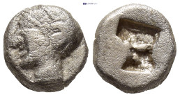 Ionia, Phokaia. AR archaic obol (8mm, 1.14 g) Ca. 510-494 B.C. Helmeted female head left, hair in sakkos, wearing rosette-earing / Four-part incuse sq...